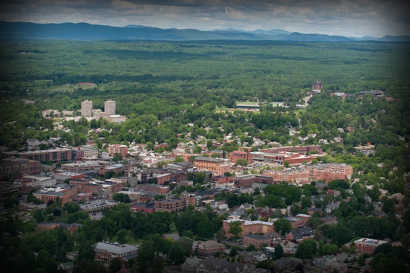 Luxury sedan from Saratoga, NY Chauffeur Service parked near downtown Saratoga Springs for executive transportation