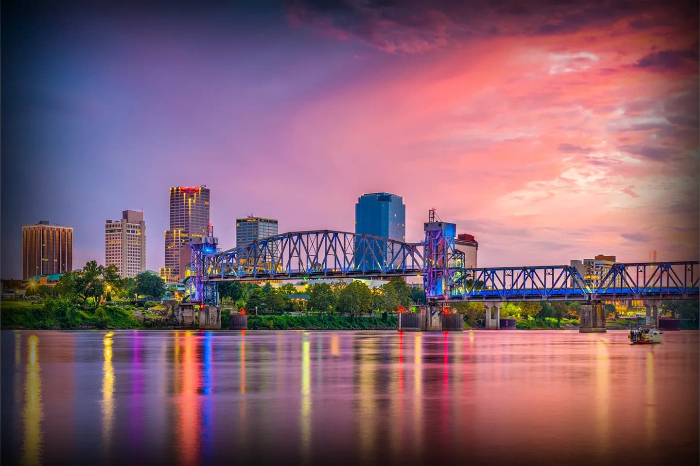 Professional chauffeur opening door of black car service vehicle in Arkansas AR Car Service downtown