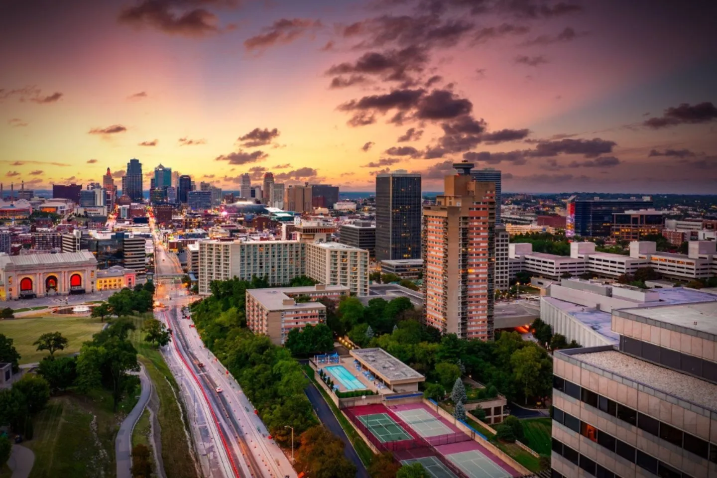 Professional driver providing Missouri MO car service for corporate client outside office building