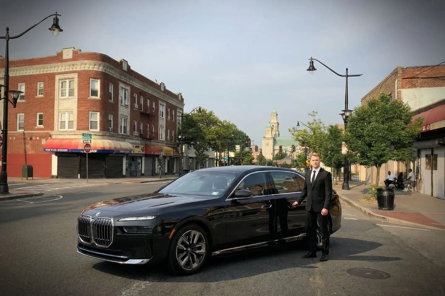 Luxury sedan arriving for Essex, NJ Car Service airport pickup with professional chauffeur in clean black car