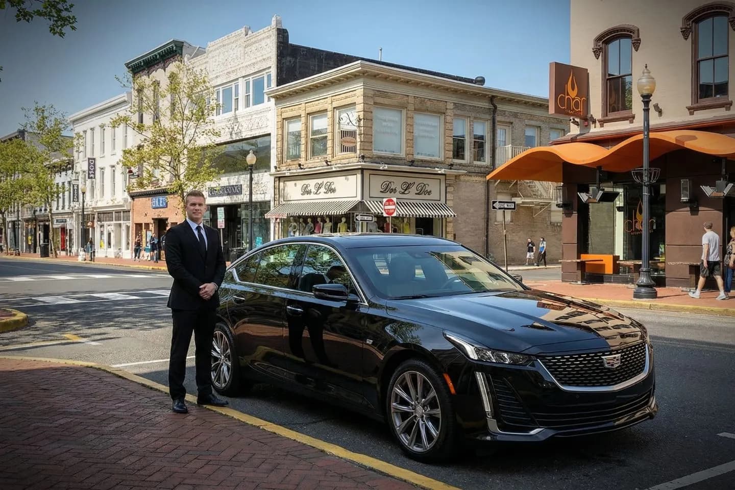 Monmouth, NJ Car Service luxury chauffeur sedan arriving at airport terminal in Monmouth County