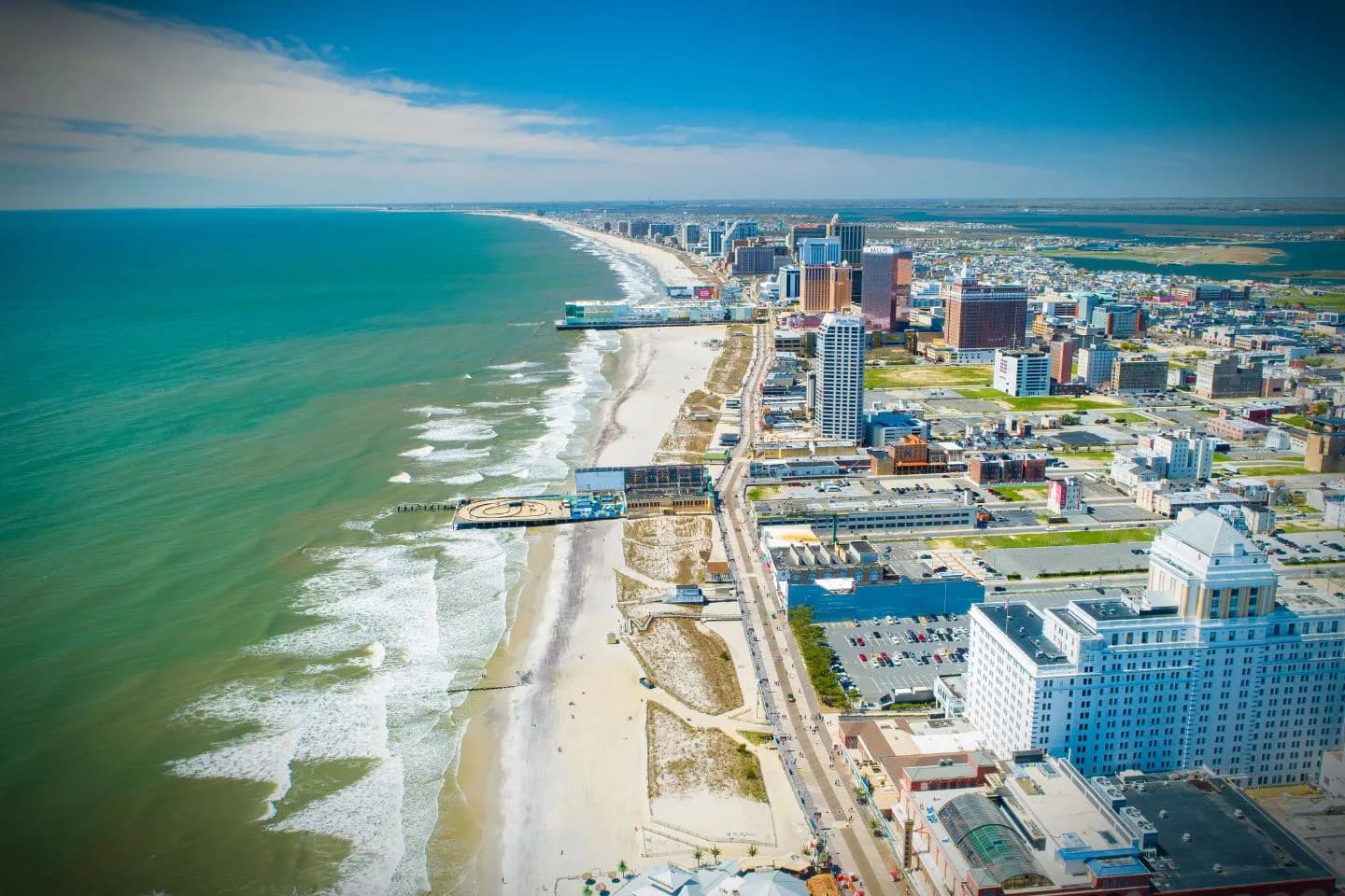 Professional driver opening car door for client Ocean NJ Car Service