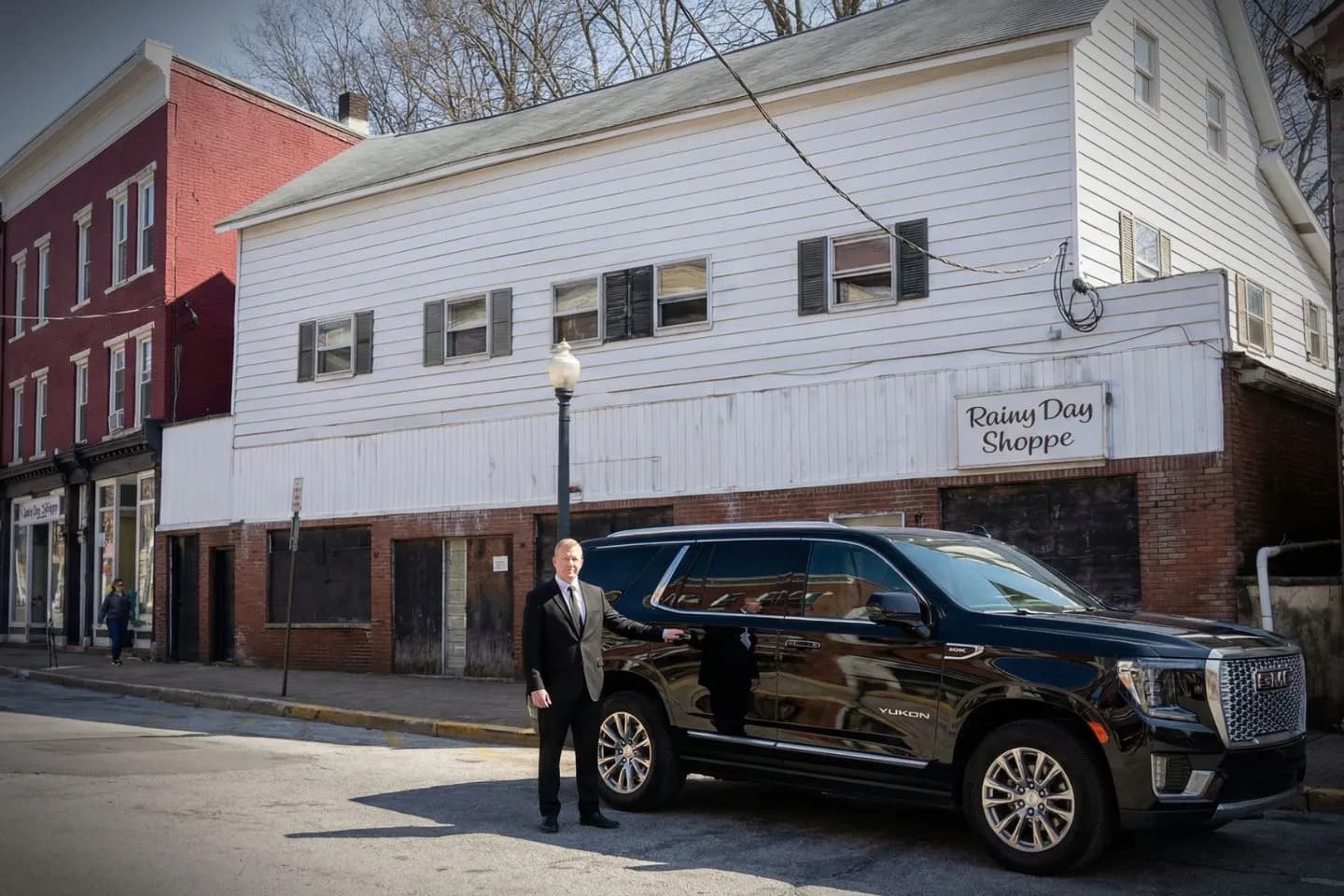 Night executive sedan for Somerset NJ Car Service with city lights background Somerset NJ