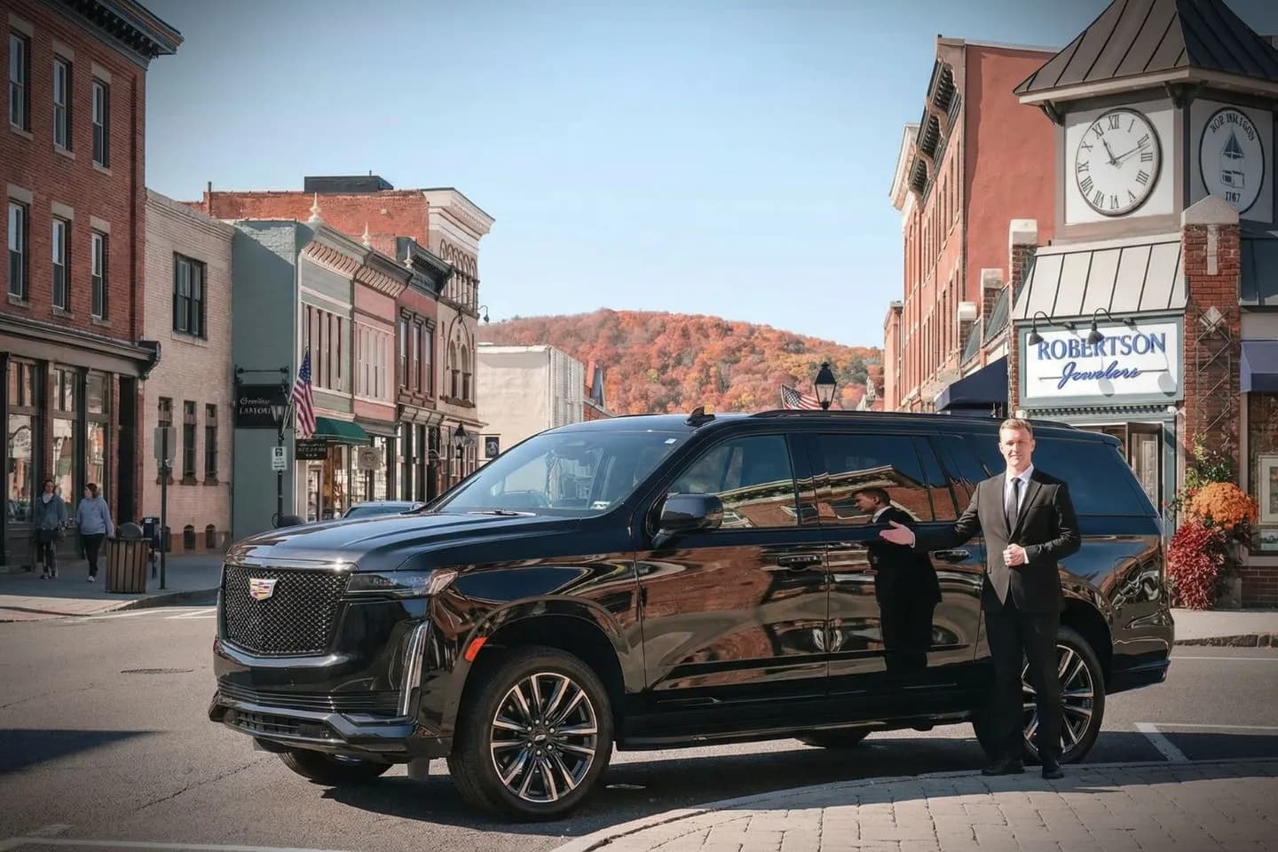 Chauffeur opening door for client using Litchfield, CT Car Service in upscale travel setting