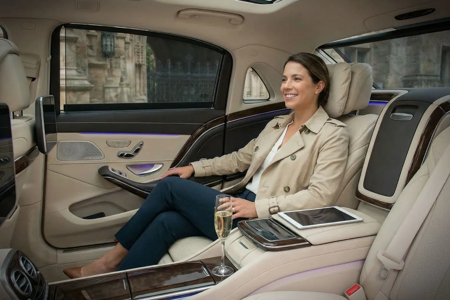 Chauffeur opening door for passenger using New Haven CT car service at airport terminal