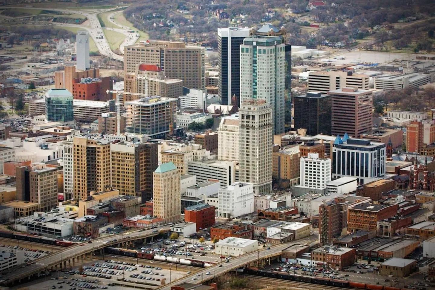 Wedding couple entering luxury car provided by Alabama, AL Chauffeur Service with professional driver