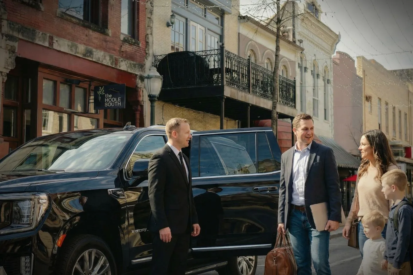 Executive SUV from Alabama, AL Chauffeur Service parked at hotel entrance for business traveler pickup