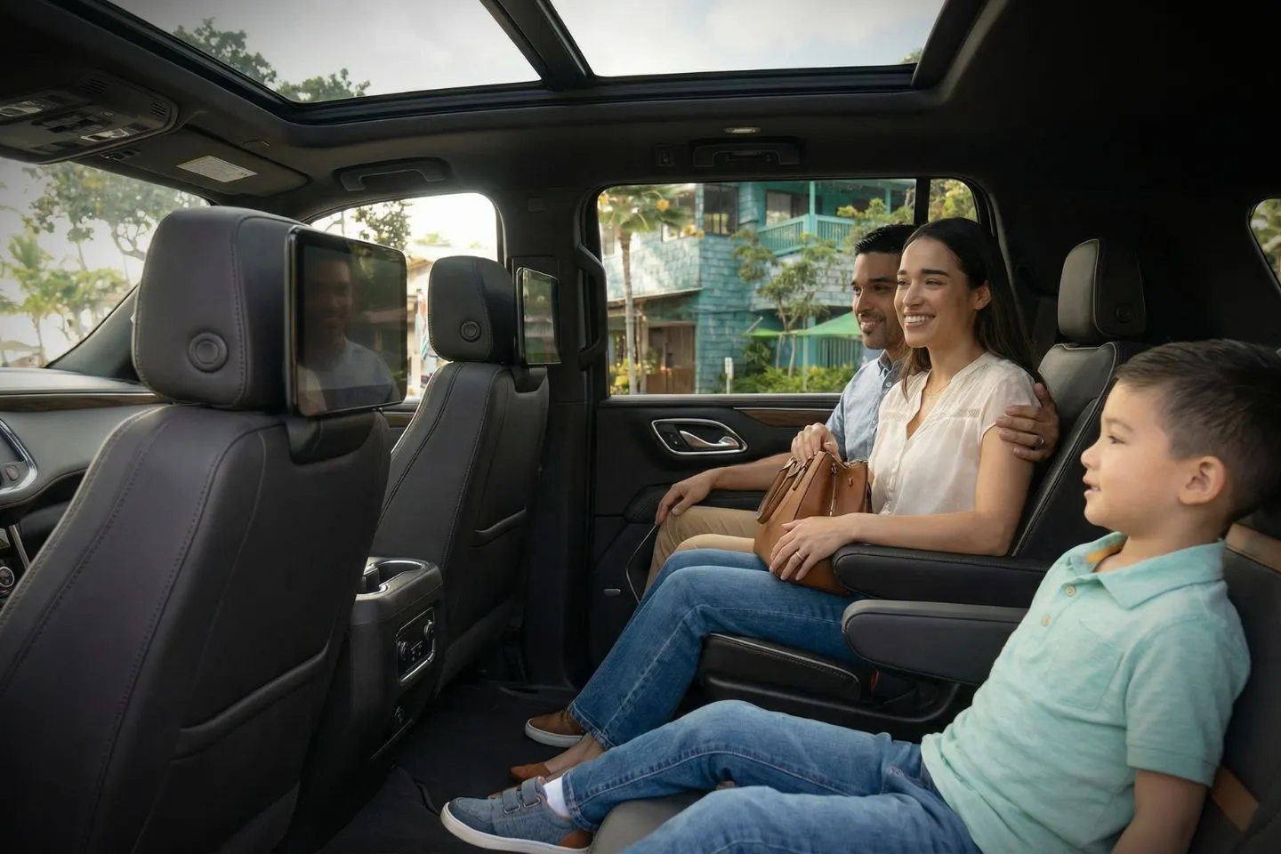 Black SUV from Hawaii, HI Chauffeur Service driving along scenic coastal highway