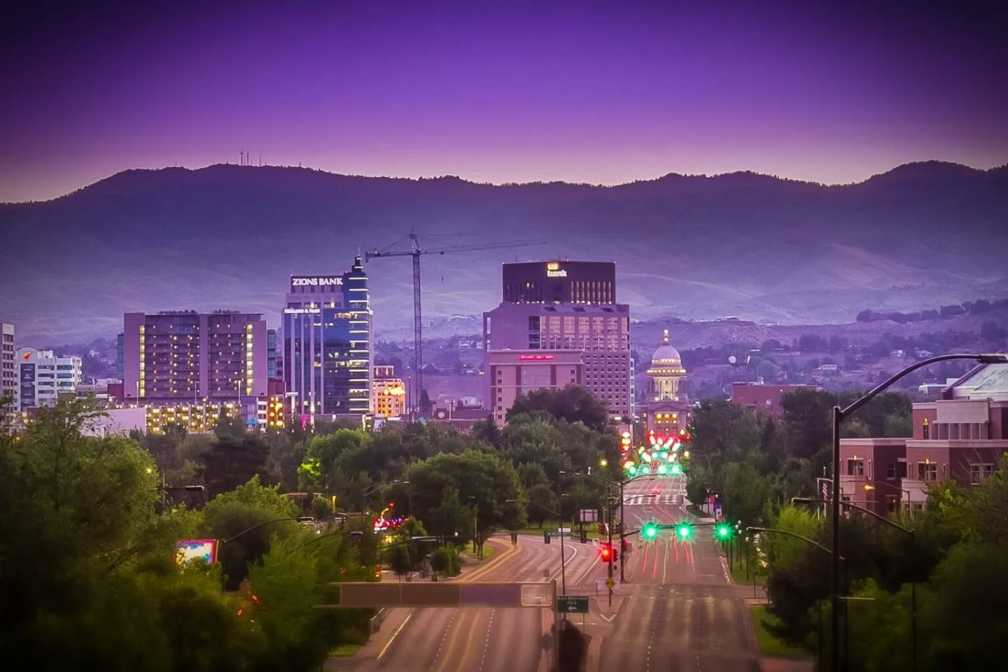 Professional chauffeur driving client through city streets with Idaho chauffeur service