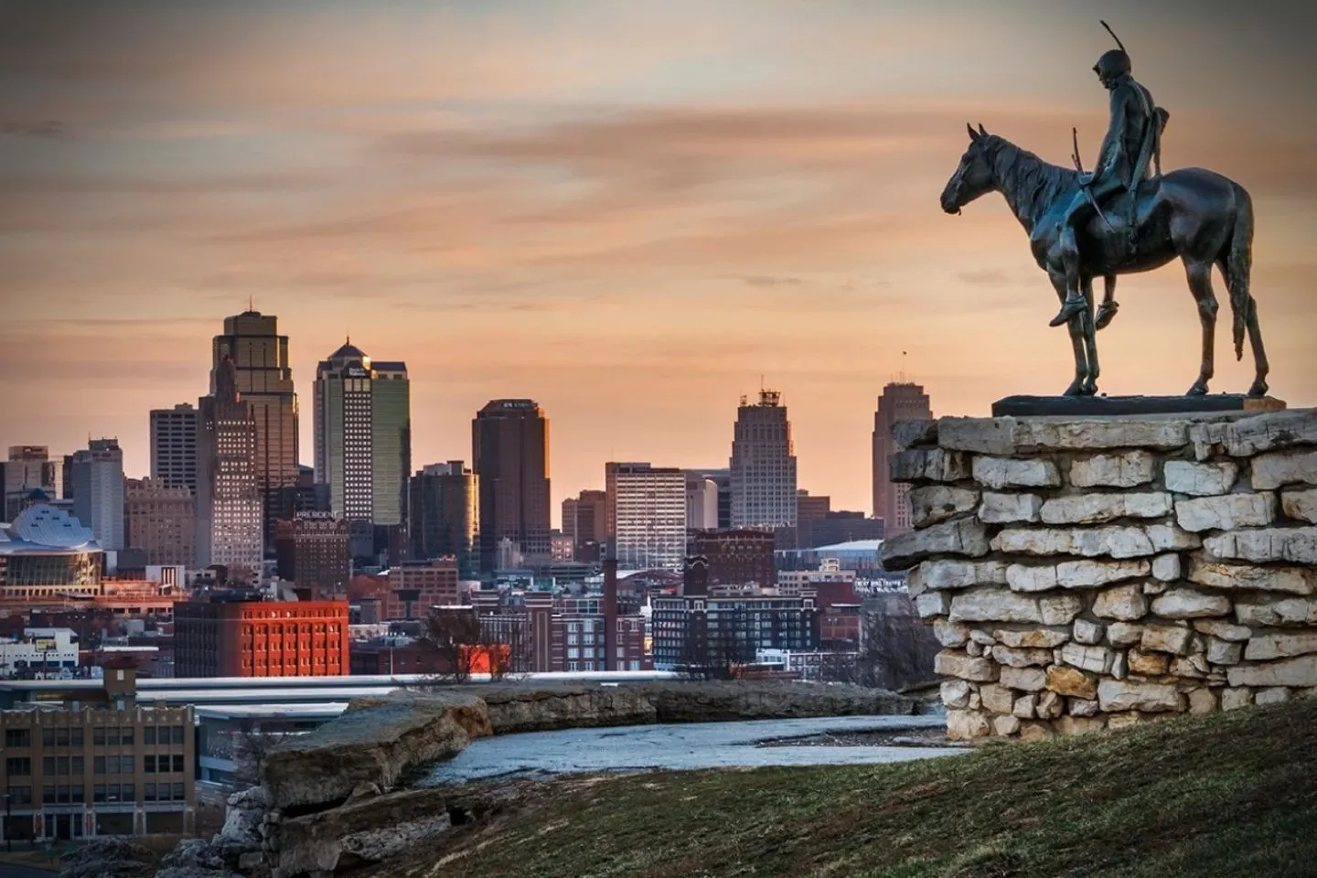Kansas, KS Chauffeur Service night city ride premium black car glowing lights safe transport Kansas metro