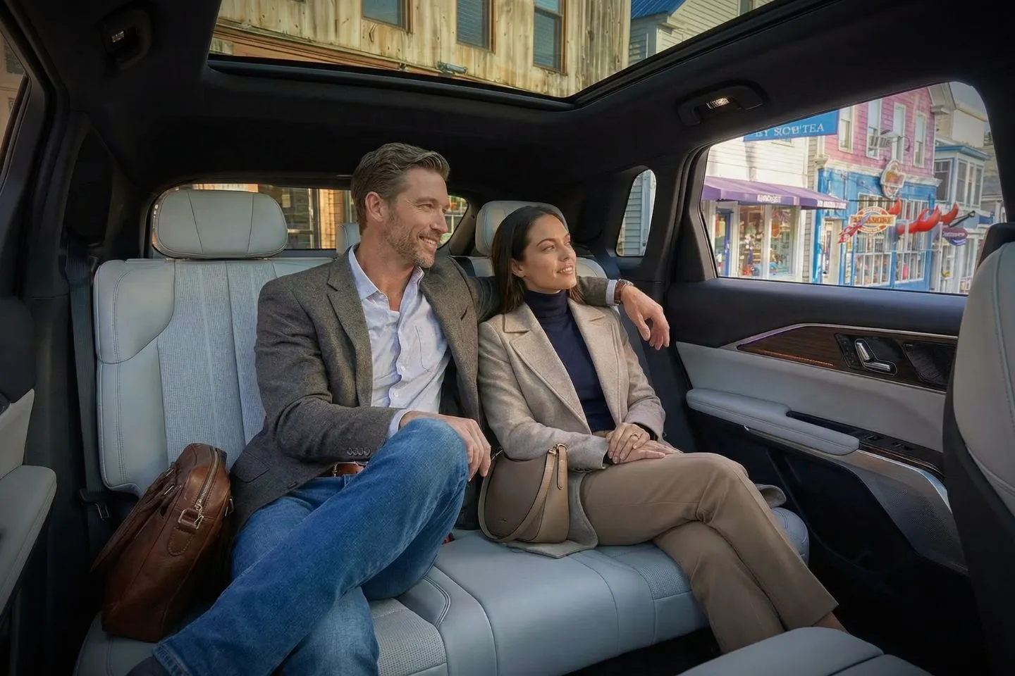 Maine, ME Chauffeur Service luxury black sedan parked near coastal road with professional driver