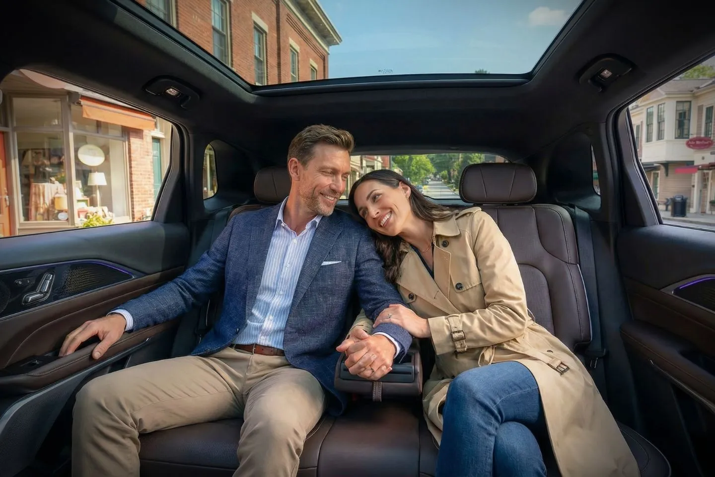 Chauffeur service in Massachusetts with black luxury car driving through city streets at night