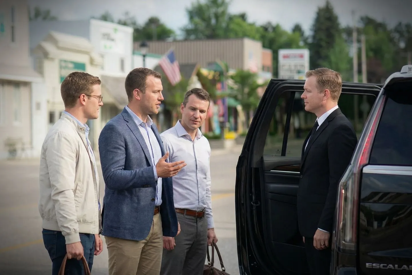 Michigan, MI Chauffeur Service executive SUV ready for airport transfer with uniformed chauffeur