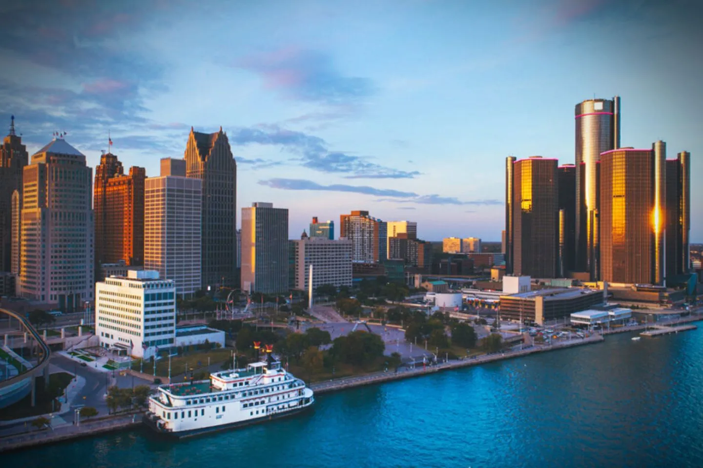 Airport pickup by Michigan Chauffeur Service with driver assisting passenger with luggage in Michigan