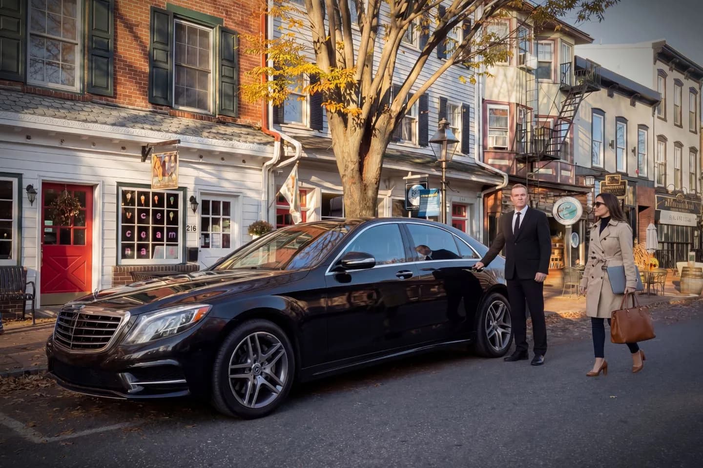 Corporate traveler using Minnesota, MN Chauffeur Service with sleek sedan in Minneapolis business district