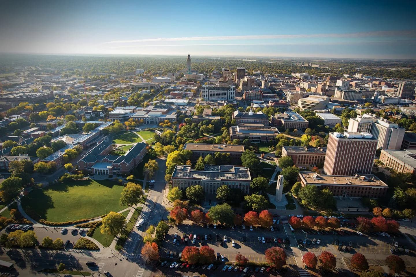 Chauffeur opening door for client using Nebraska luxury transportation service