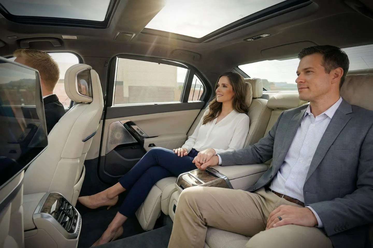 Chauffeur assisting passengers with luggage during New Mexico, NM Chauffeur Service airport transfer