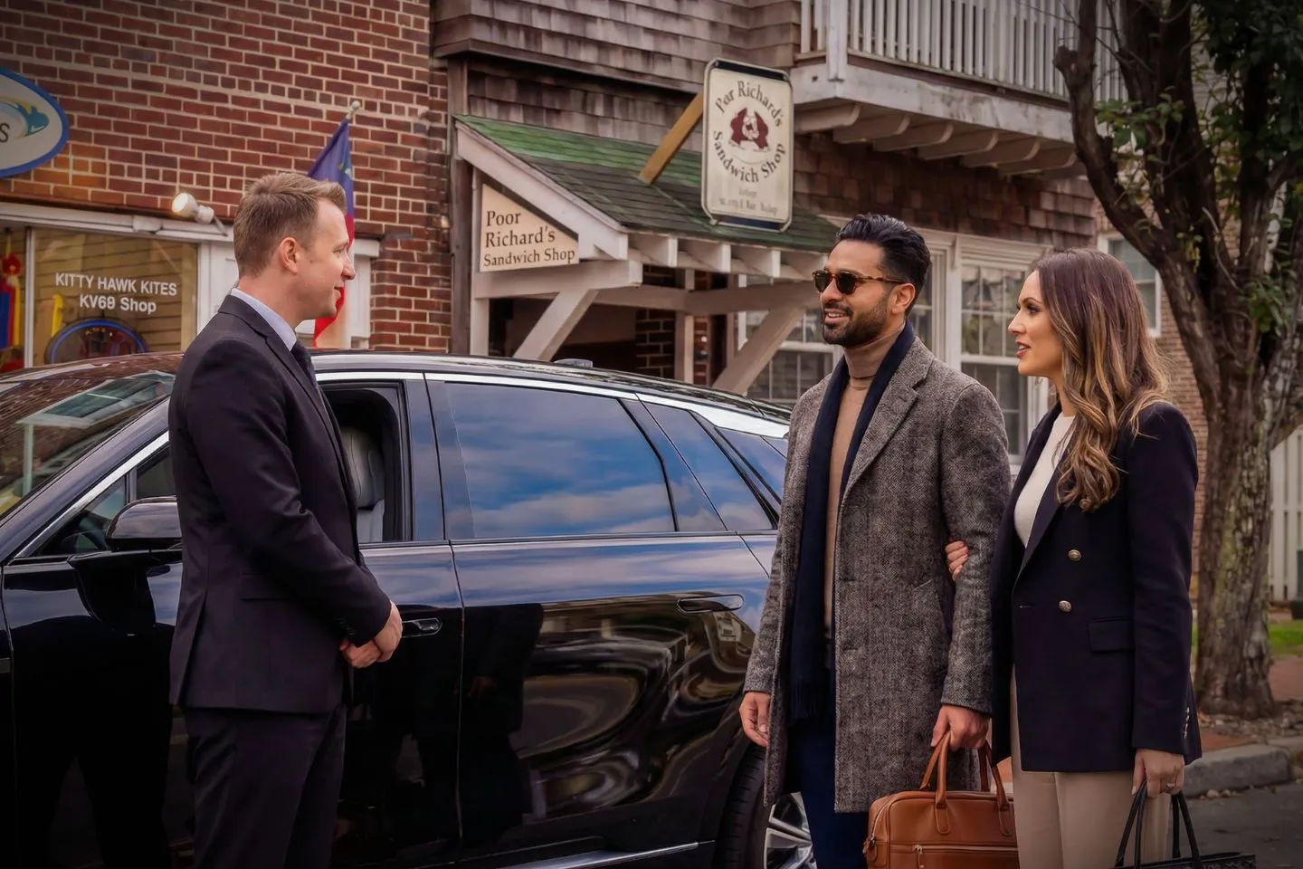 Executive SUV providing North Carolina chauffeur service near downtown skyline during business travel