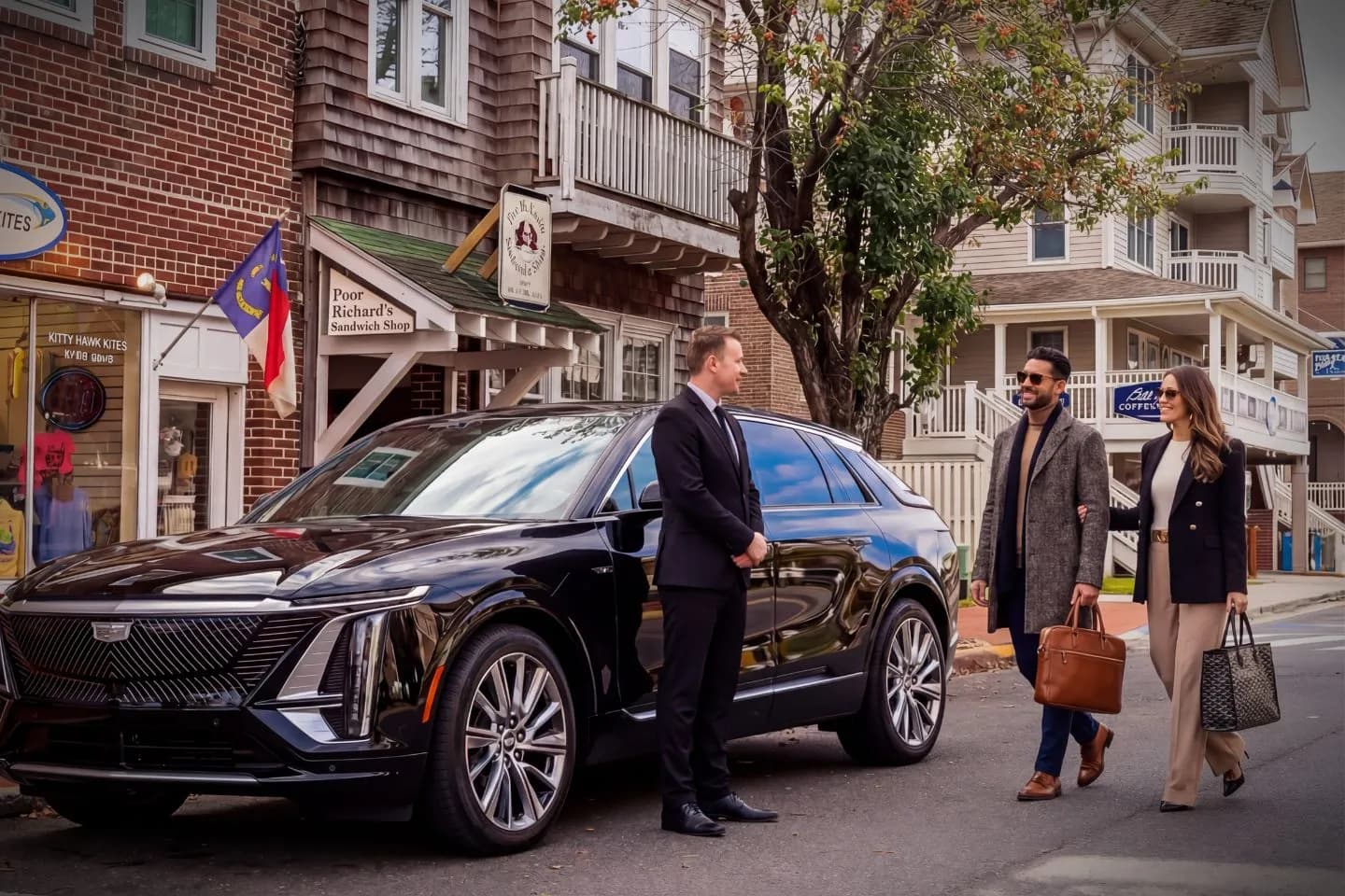 Professional chauffeur opening door for client using North Carolina, NC Chauffeur Service in city setting