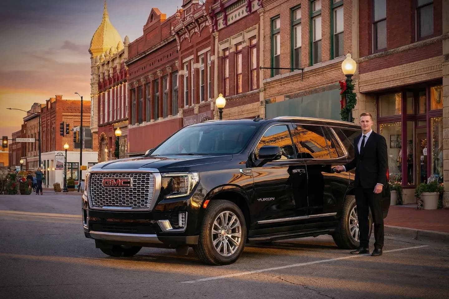 Luxury sedan from North Dakota, ND Chauffeur Service parked outside upscale hotel with professional chauffeur standing beside vehicle