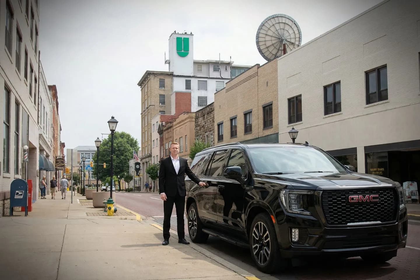 Chauffeur assisting passenger with luggage during West Virginia, WV Chauffeur Service pickup