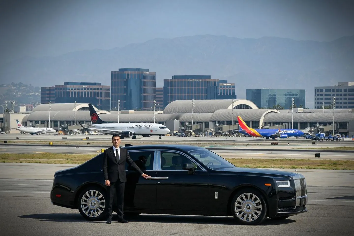 Professional chauffeur driving California, CA Car Service client through city streets in luxury SUV