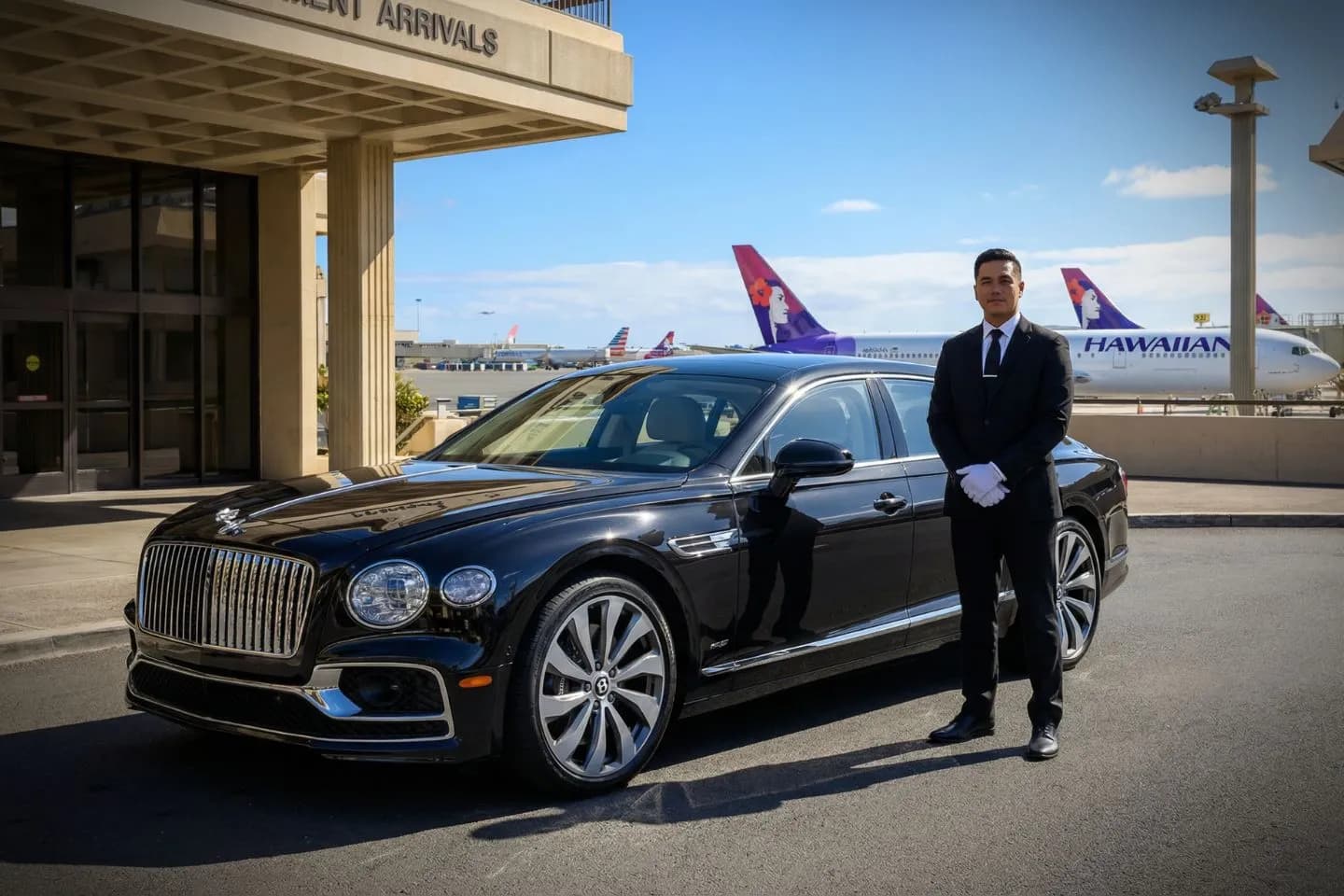 Luxury sedan from Hawaii, HI Car Service parked near Honolulu airport with professional chauffeur ready for pickup