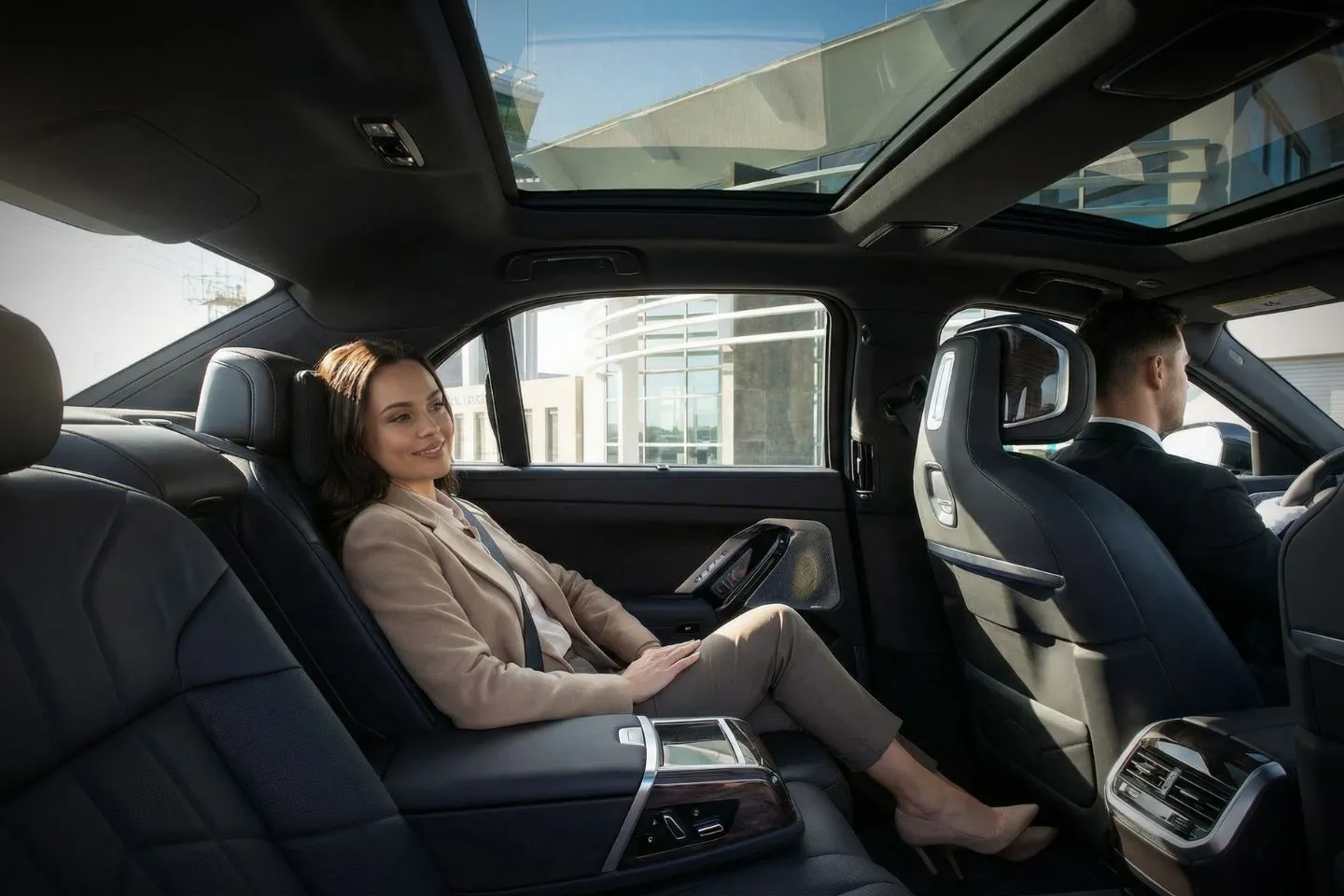 Black SUV from New Mexico, NM Car Service driving through scenic desert highway at sunset