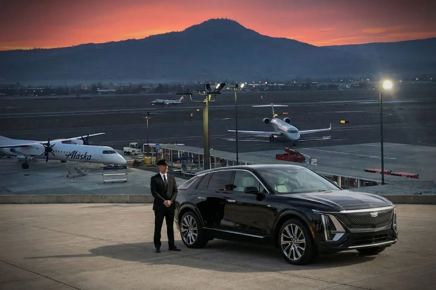 Airport pickup sign and luxury vehicle for Oregon OR Car Service travel experience