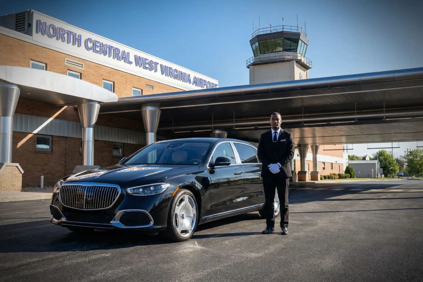 West Virginia, WV Car Service luxury sedan with chauffeur waiting at airport terminal