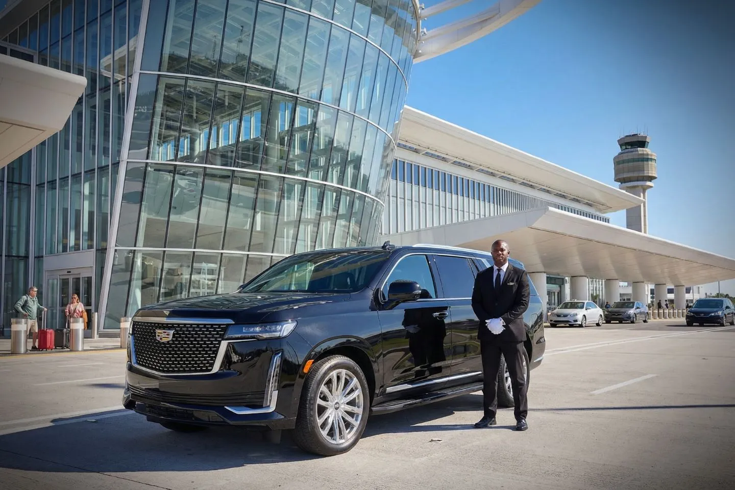 LBE Car Service chauffeur assisting passenger at Orlando airport terminal