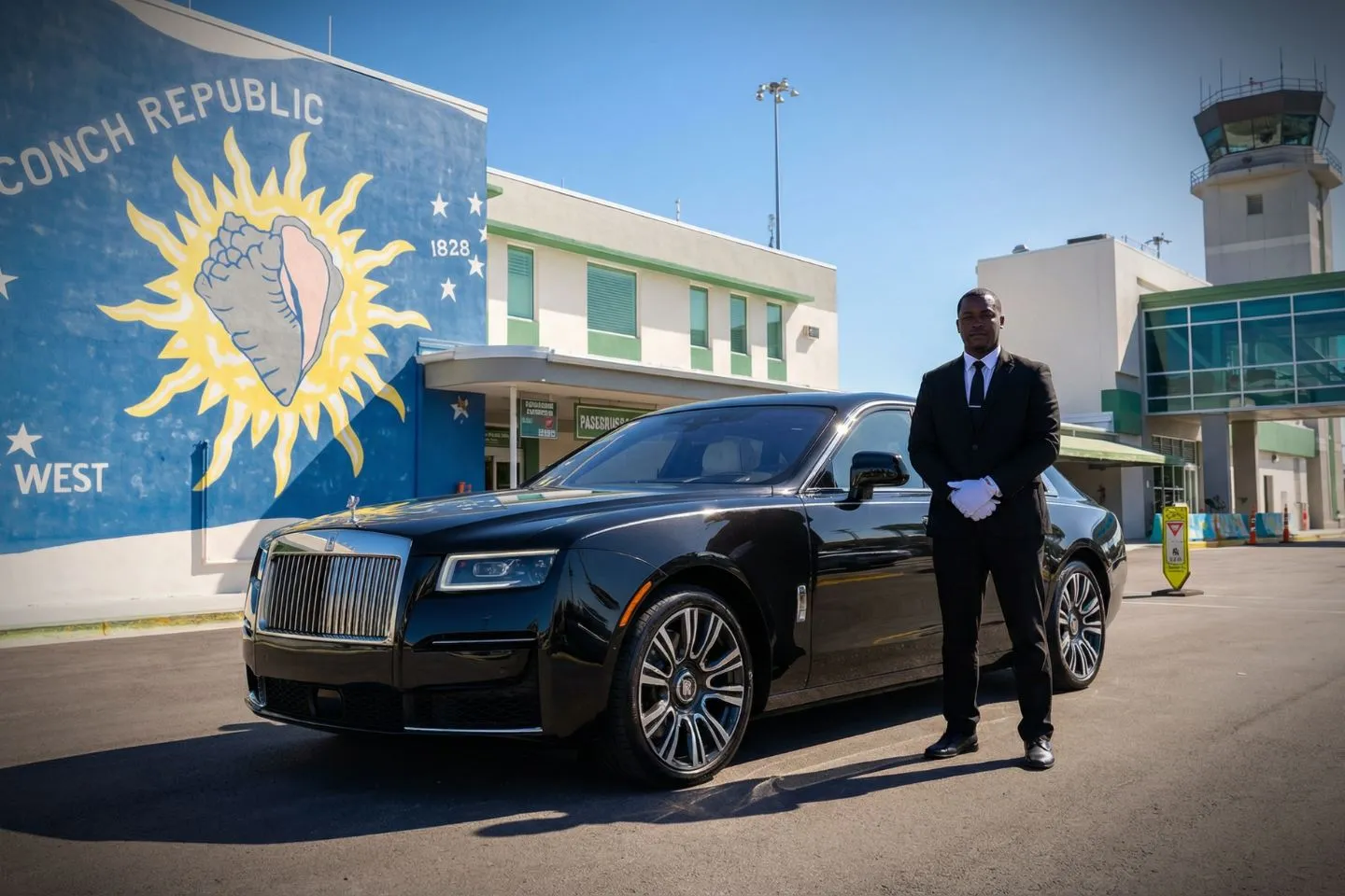 Key West International (EYW) Car Service luxury sedan at airport terminal Florida FL