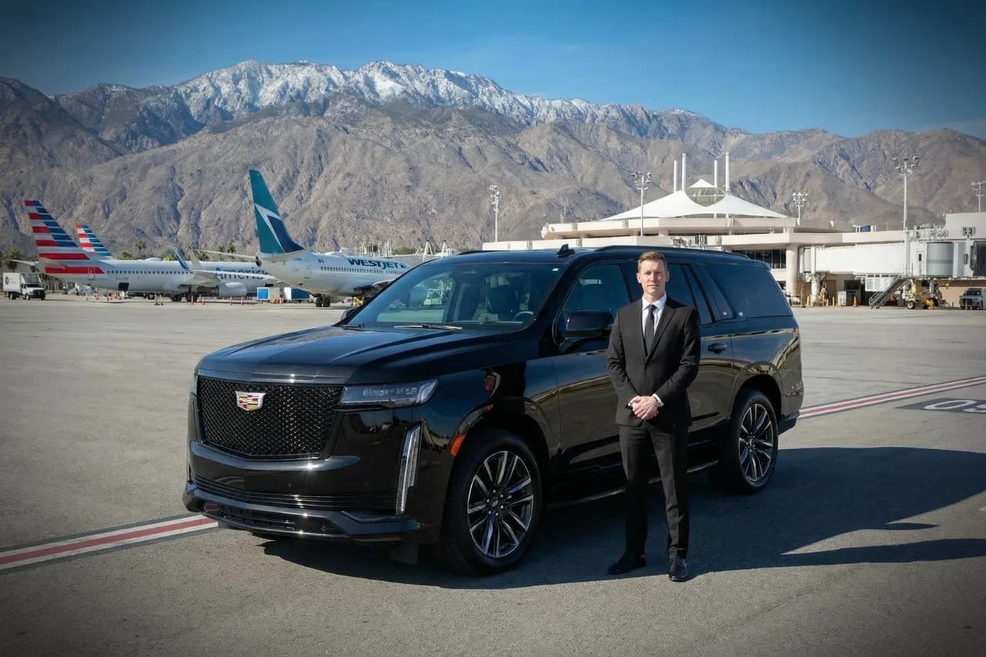 Black Cadillac Escalade chauffeured ride from PSP airport to La Quinta Resort and Club