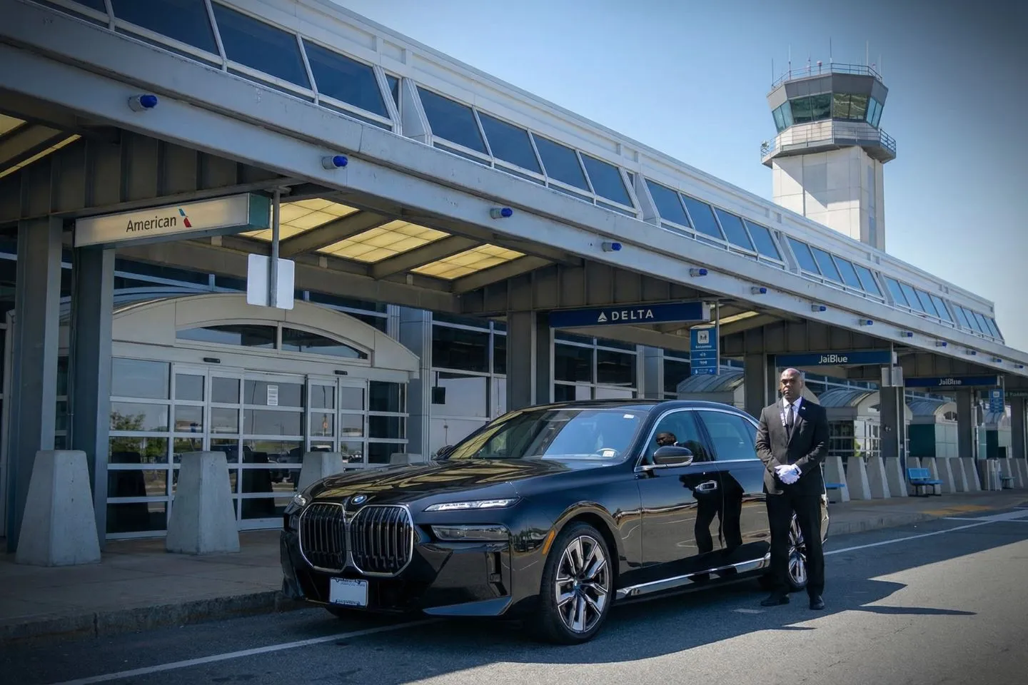 Black BMW 7 Series chauffeured car at Worcester airport for ride to Sturbridge and central Massachusetts