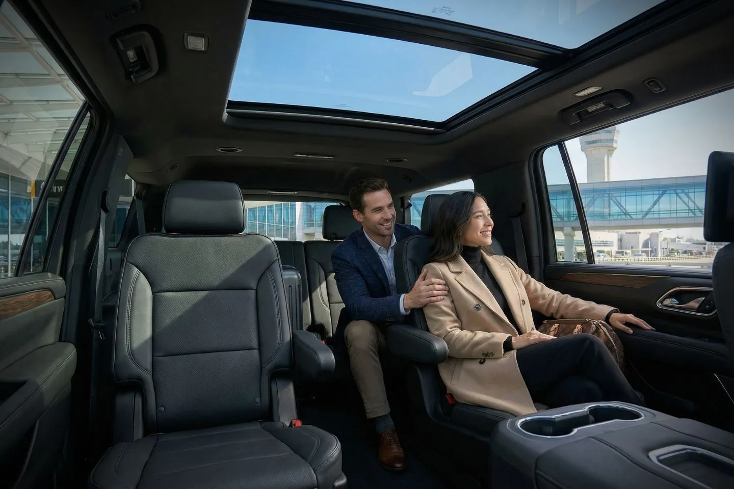 Professional chauffeur greeting passenger at Hobby Airport arrivals