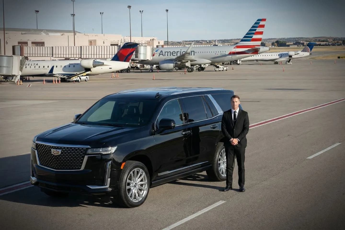 Luxury black Mercedes Benz S Class at Colorado Springs Airport COS terminal curbside in Colorado