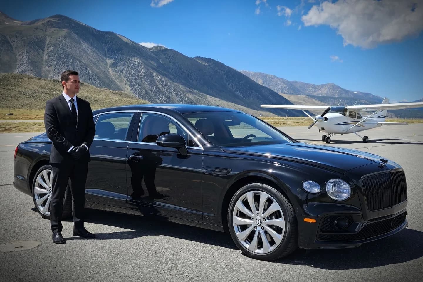 Luxury black Mercedes Benz S Class at Mammoth Yosemite Airport MMH terminal curbside in California