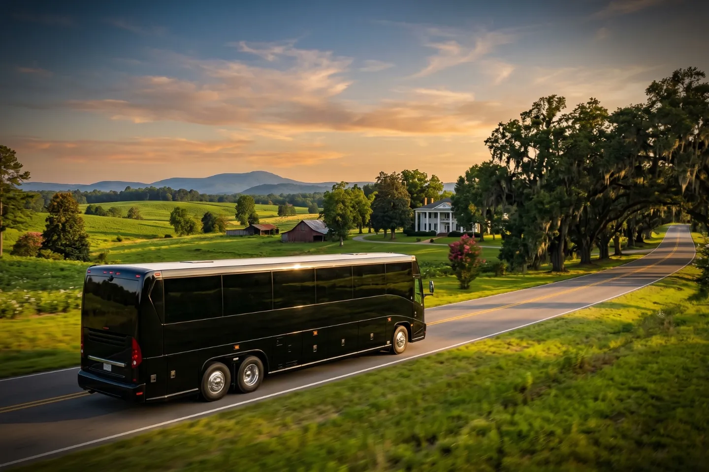 White charter bus parked outside a downtown Birmingham hotel awaiting an Alabama tour group