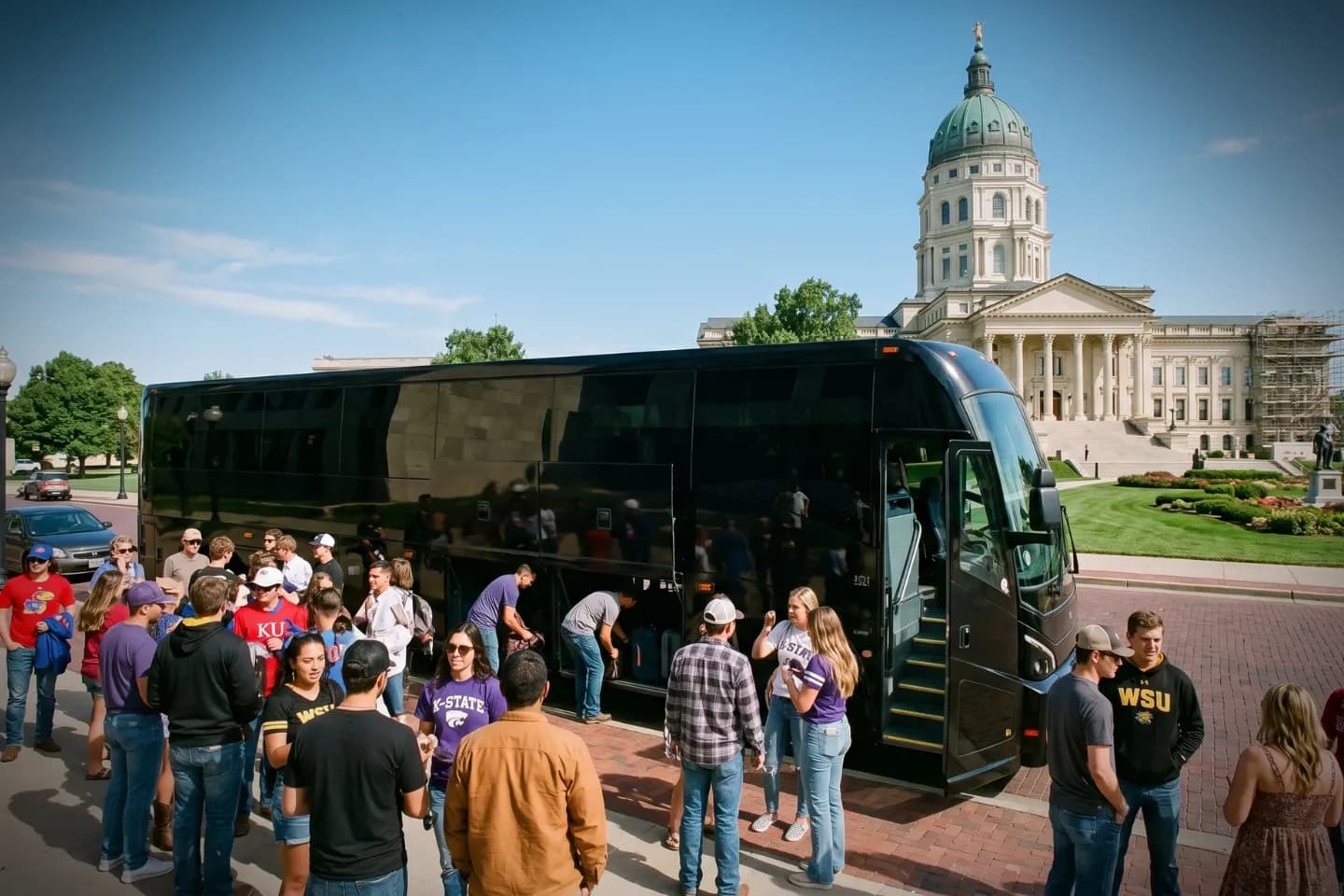 Motorcoach traveling along an open prairie interstate on a Kansas charter route