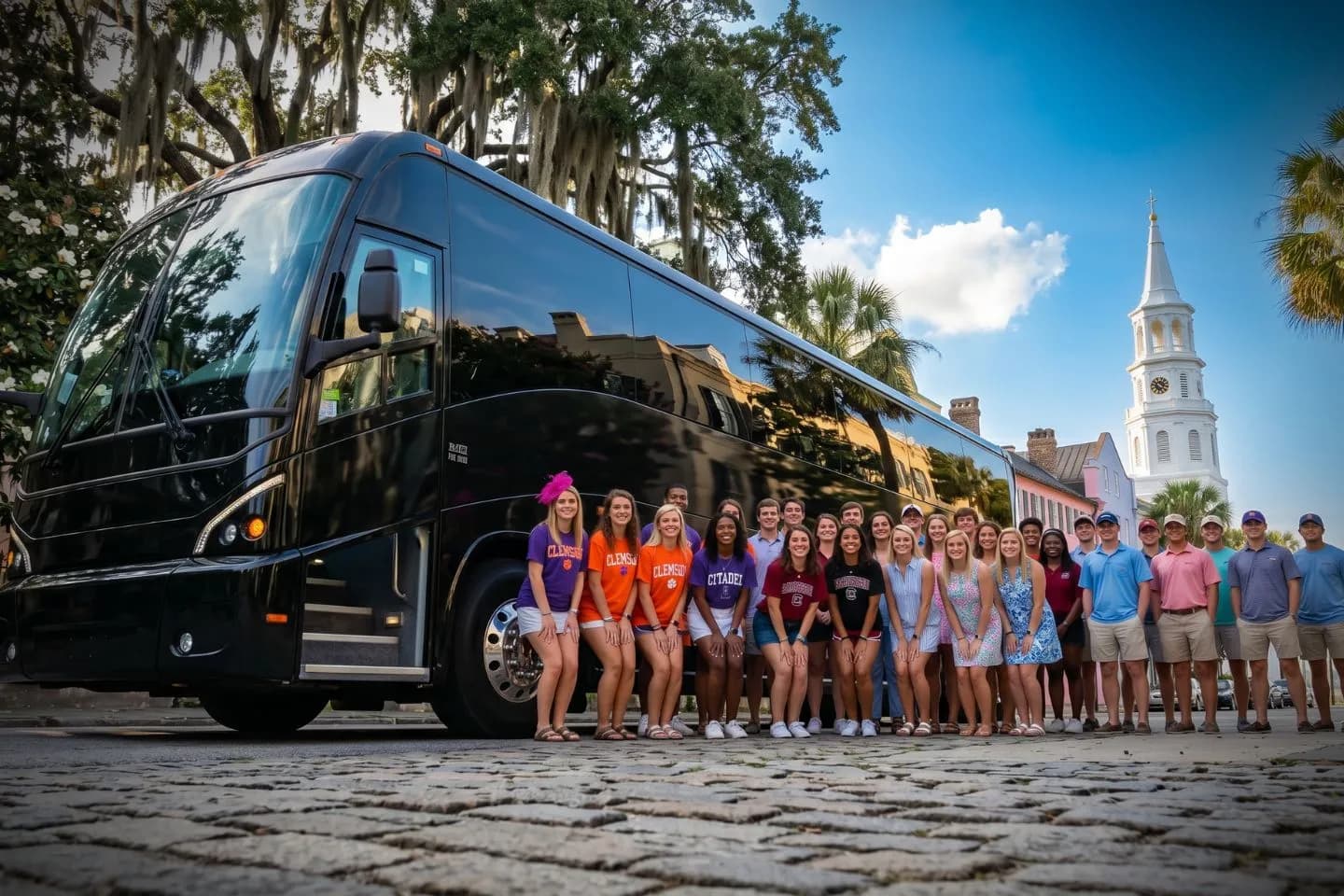 Travelers loading luggage into a modern charter bus for a South Carolina group trip