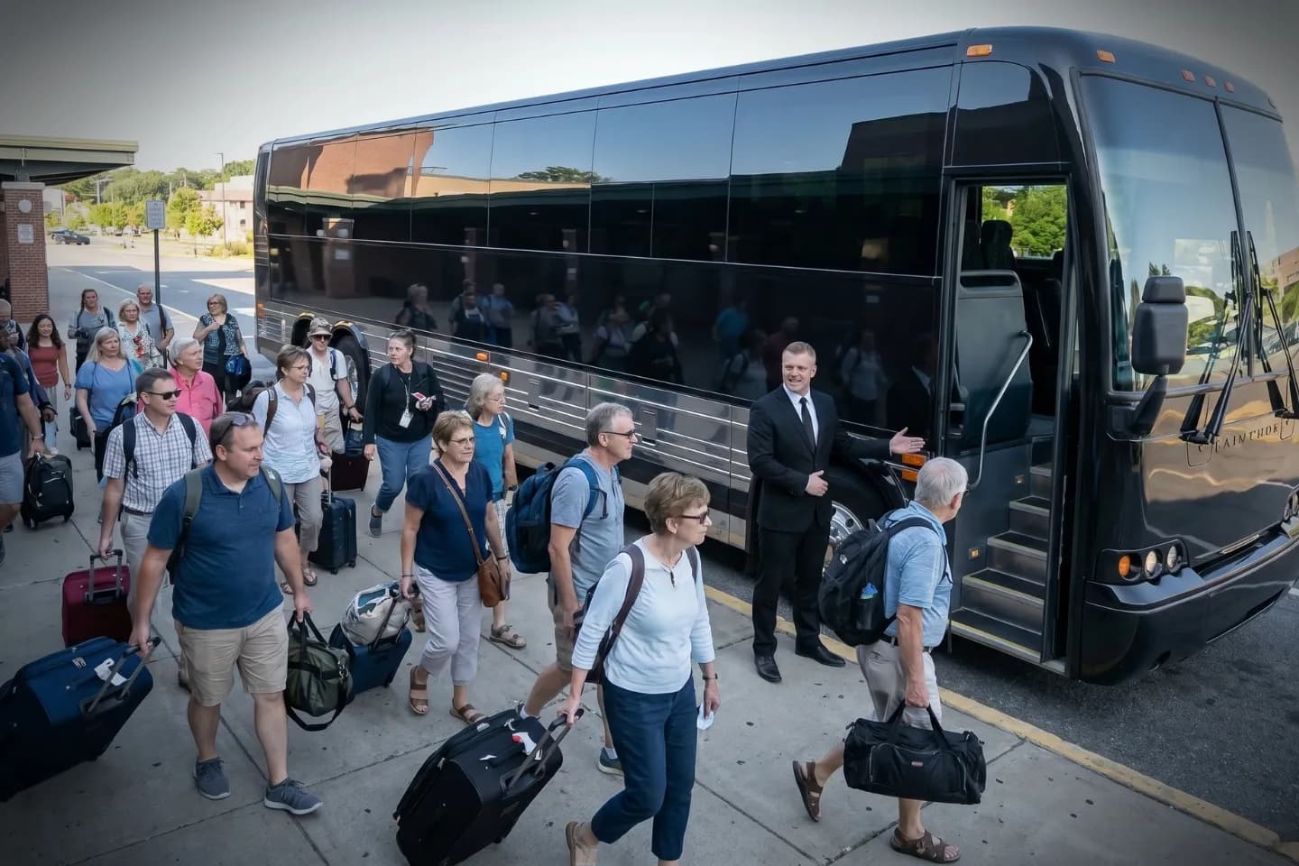 Motorcoach parked outside New York Stewart International Airport awaiting a group