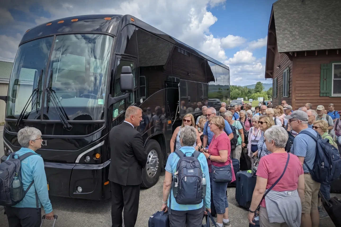 Passengers boarding a motorcoach at the SLK Airport pickup area