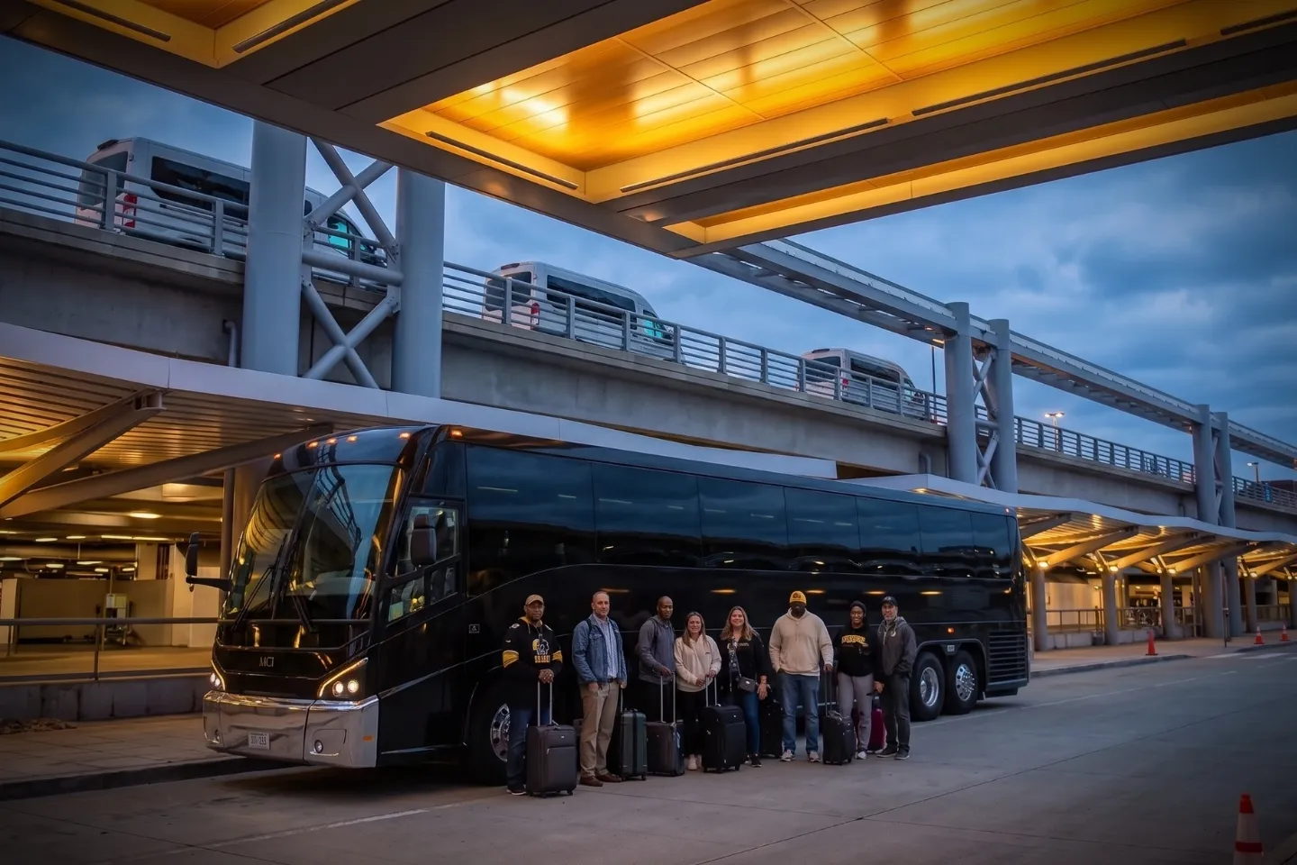 Group boarding a charter bus rental outside Pittsburgh International Airport baggage claim