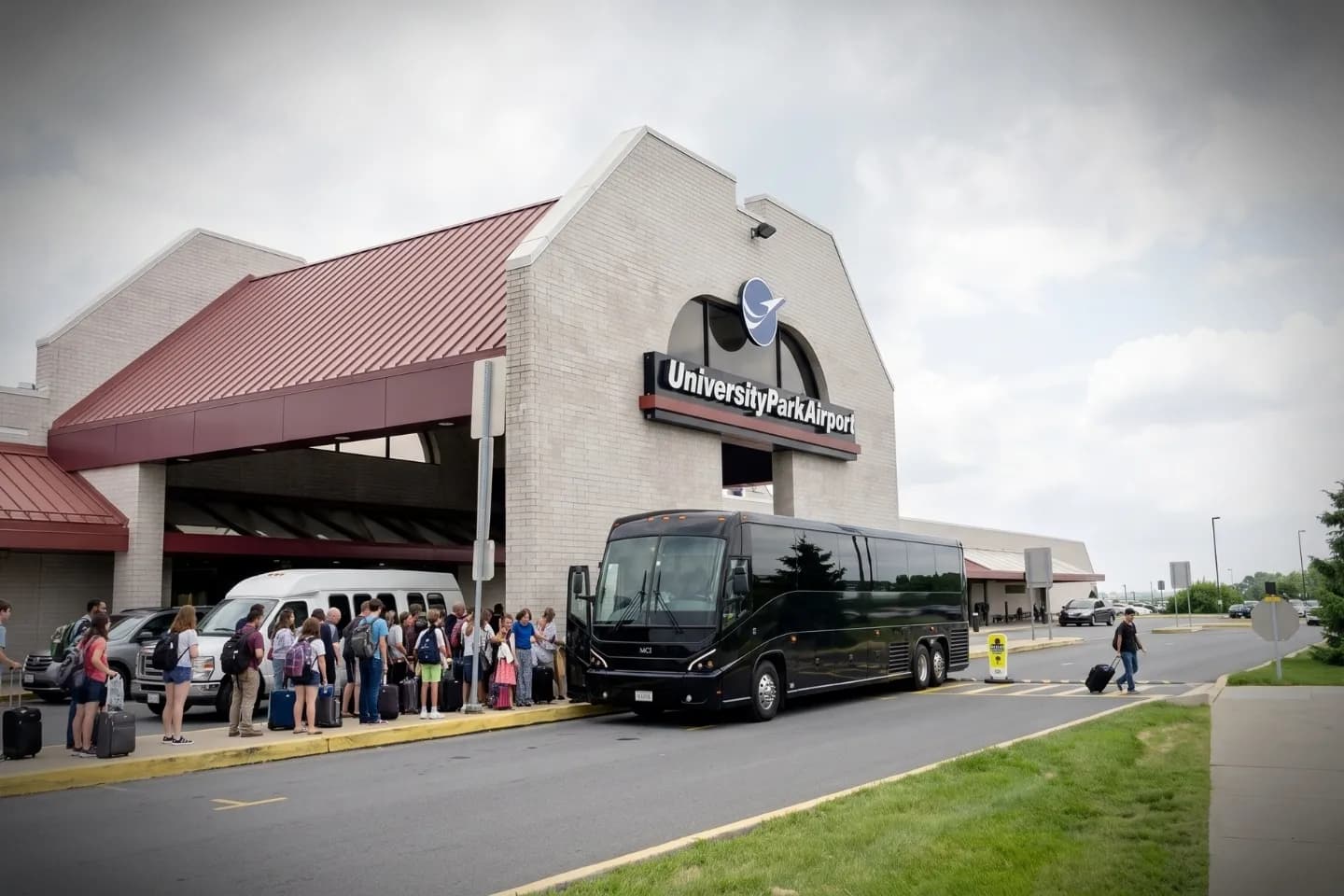 Charter bus rental waiting at the University Park Airport SCE terminal in State College