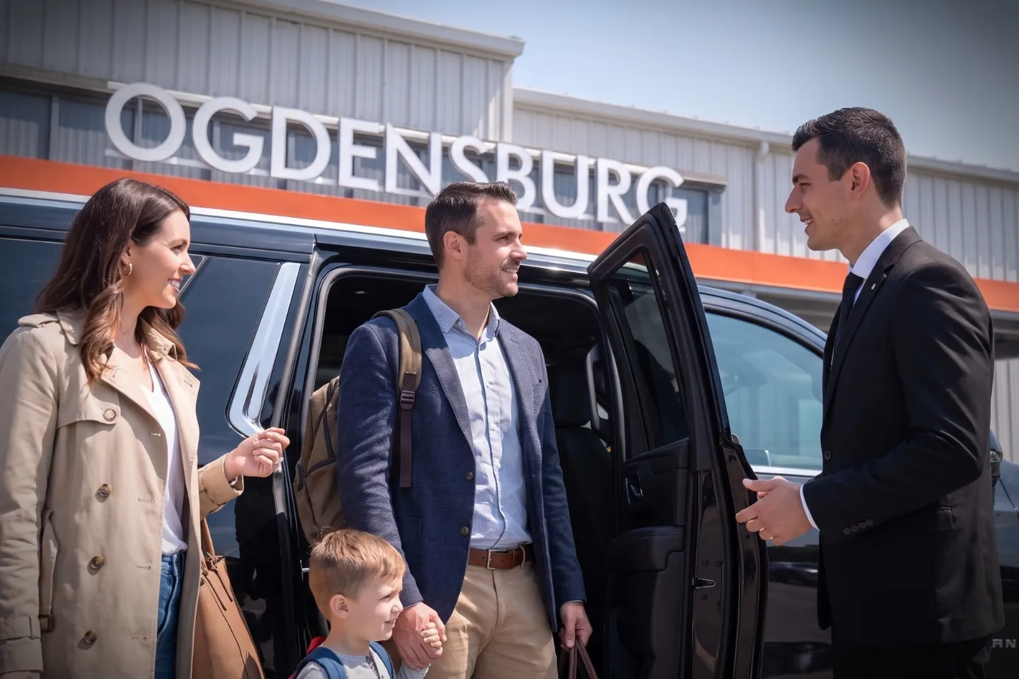 Traveler stepping into a chauffeured car at Ogdensburg International Airport New York