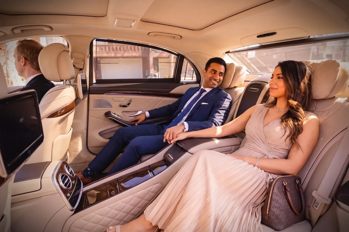 Business traveler stepping into a waiting sedan in Georgetown, Brooklyn, NY