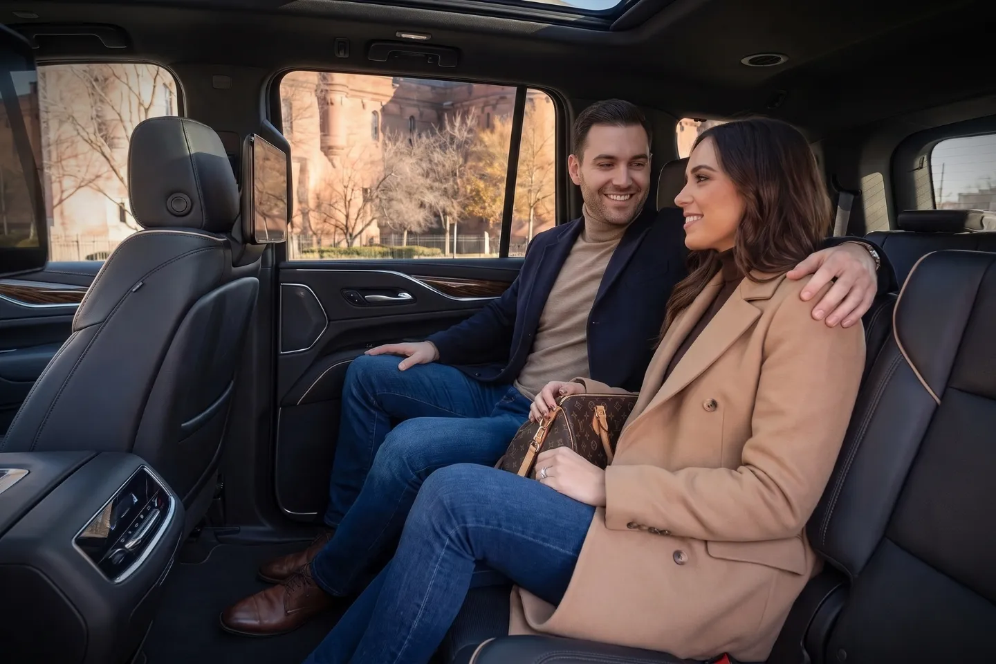 Family climbing into a spacious SUV for Kingsbridge Heights, Bronx transportation