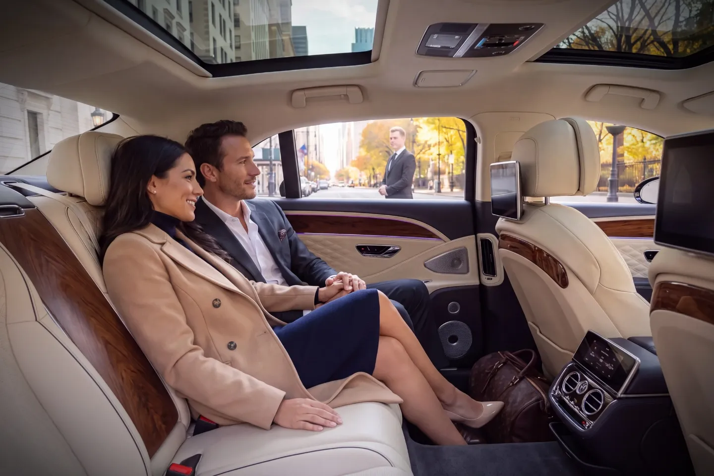 Professional chauffeur greeting a business traveler near Central Park, NY