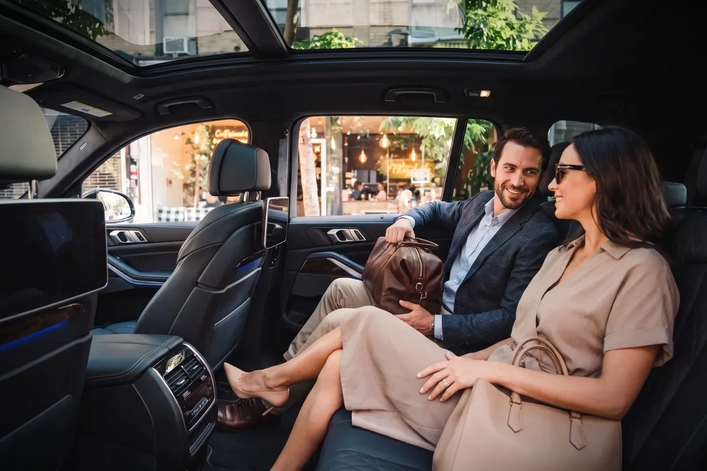 Professional chauffeur greeting a business traveler in East Village, NY