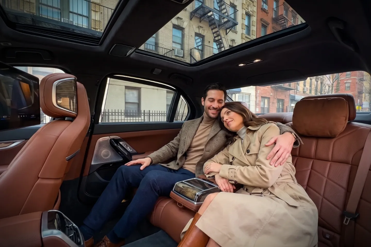 Premium black car driving past iconic cultural landmarks in Harlem, Manhattan